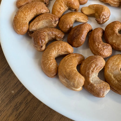 Plate of healthy handcrafted cashews in various shapes and sizes, perfect for snacking